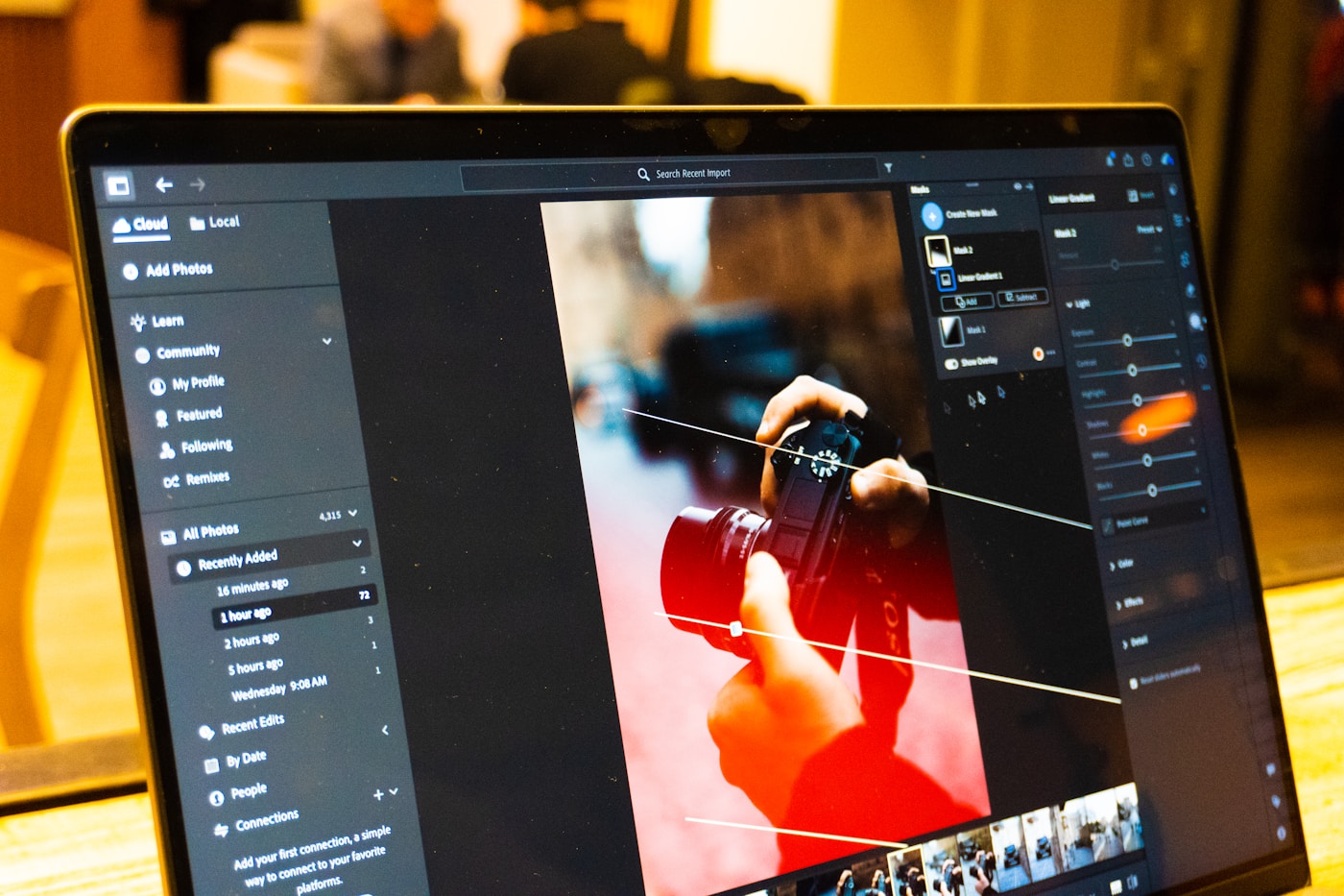 A person retouching a photo on screen